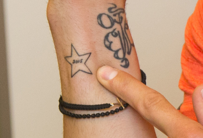 Тату Юрия Лодыгина на руке