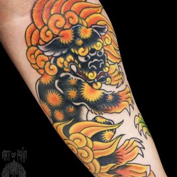 Татуировка мужская япония на предплечье лев