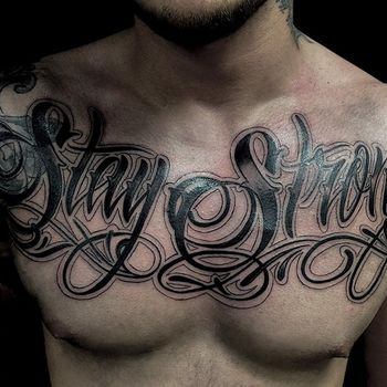 Татуировка мужская каллиграфия на груди леттеринг