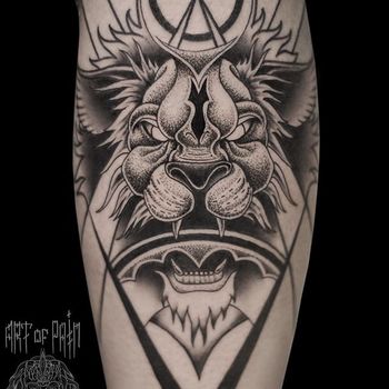 Татуировка мужская графика на икре лев в восточном стиле