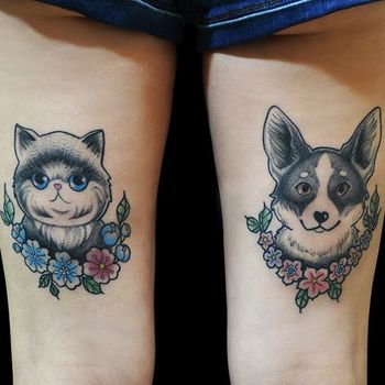 Татуировка женская графика на бедре животные: собака и кот