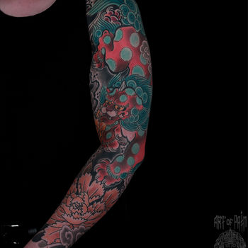 Татуировка мужская япония тату-рукав лев и пион