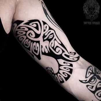 Татуировка мужская полинезия на руке слон