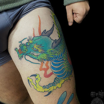 Татуировка мужская япония на бедре дракон