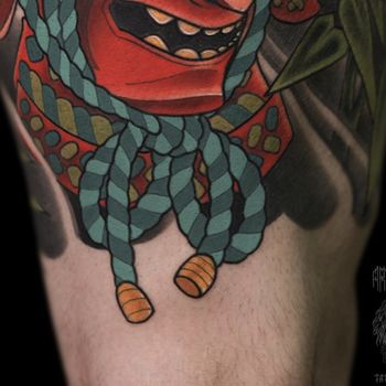 Татуировка мужская япония на бедре веревка