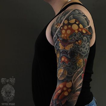 Татуировка мужская япония на плече лев